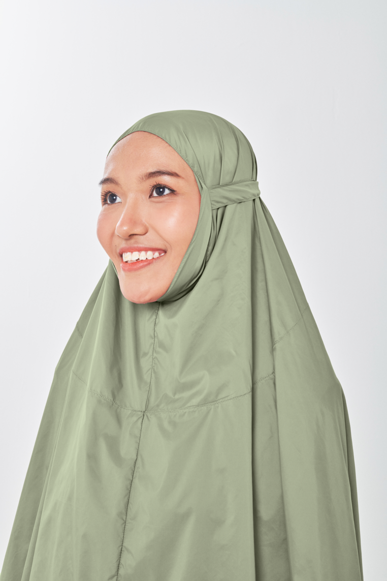Marisa on the go travel telekung worn by Muslimah at work or airport